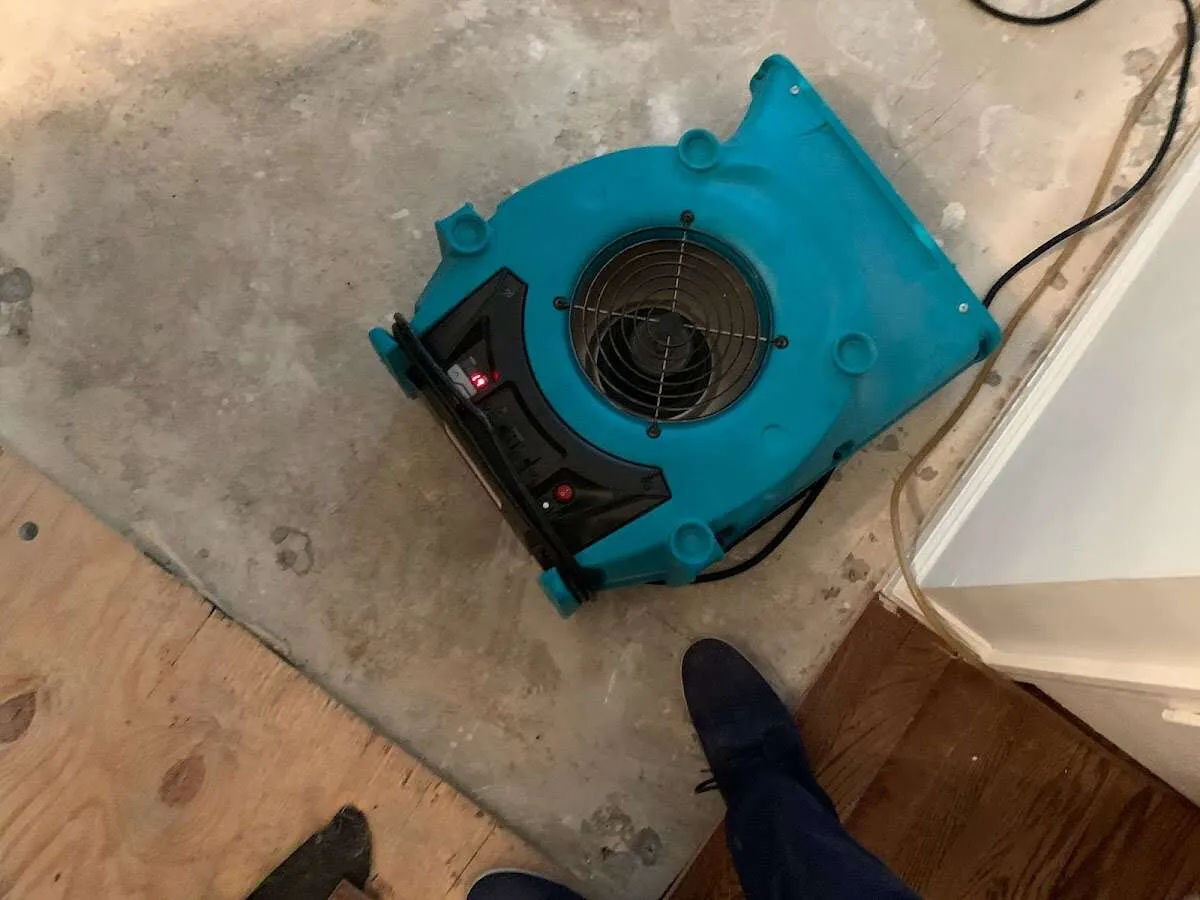 Air mover drying subfloor during Leak Detection & Repair in Greenbrier